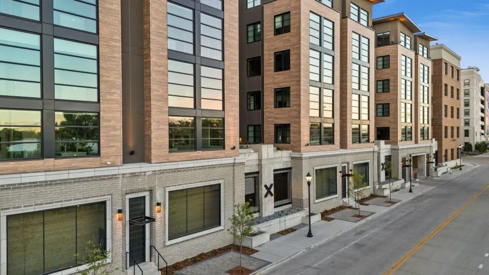 Salt Lake Crossing exterior with brick construction and large sidewalks.