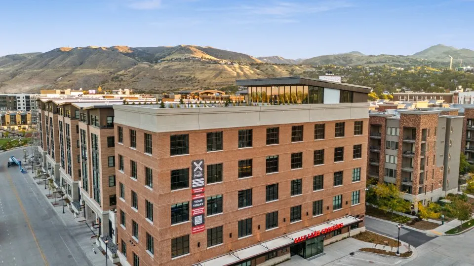 Salt Lake Crossing exterior with brick construction and rooftop deck.