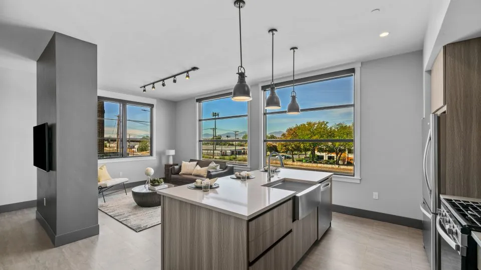 Open one bedroom apartment at Salt Lake Crossing with modern kitchen and living room.
