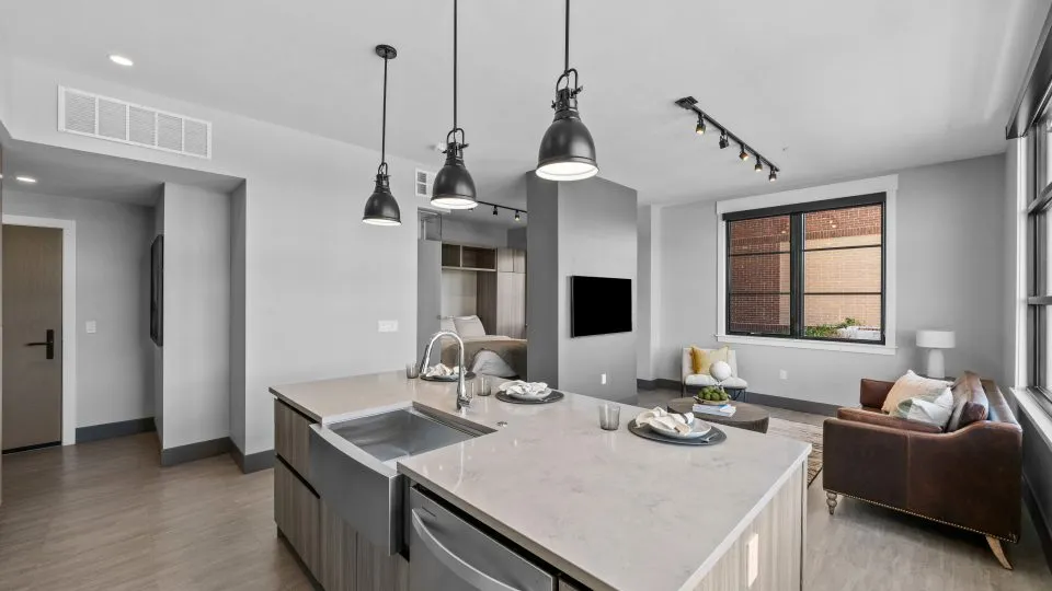 Open one bedroom apartment at Salt Lake Crossing with modern kitchen and living area.