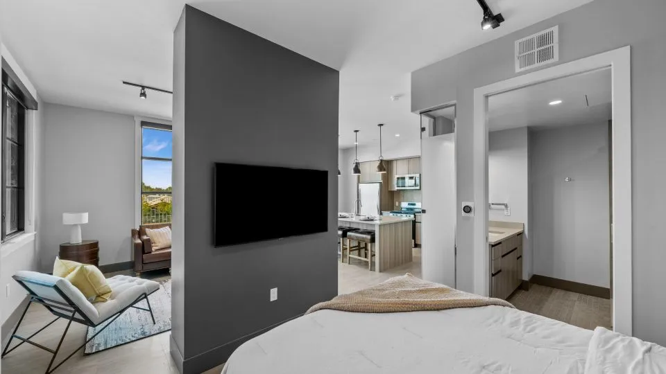Apartment at Salt Lake Crossing with open bedroom, living area, and modern kitchen.