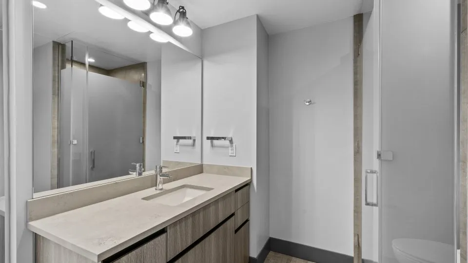 Apartment bathroom at Salt Lake Crossing with European style wet bath.