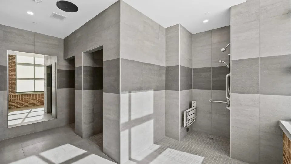 Salt Lake Crossing locker room with shower.