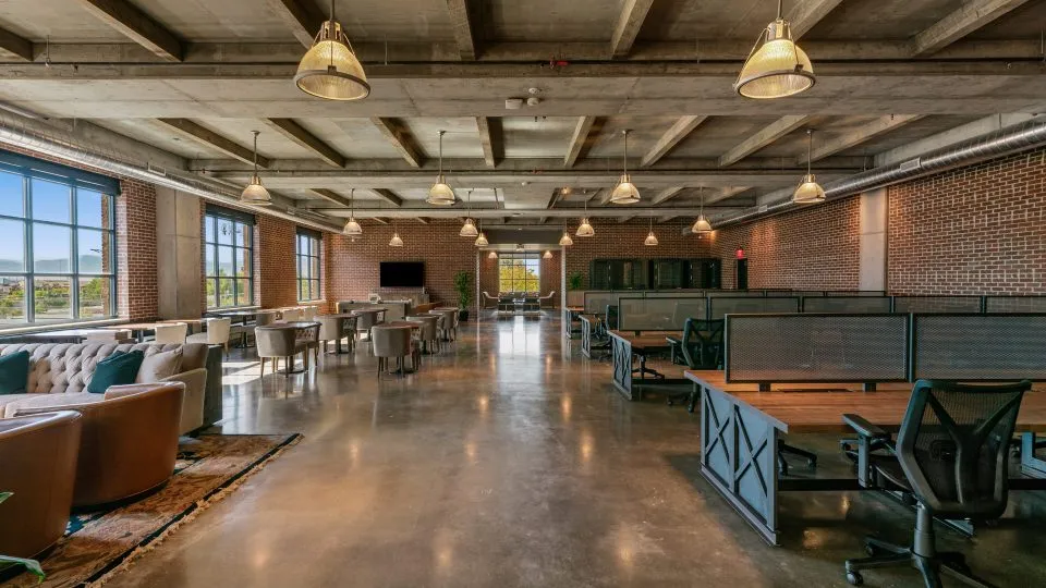 Salt Lake Crossing coworking space with plush seating and open desks.