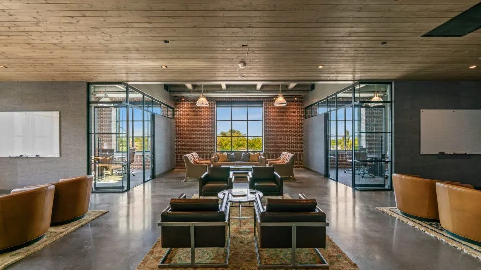 Salt Lake Crossing co-working area with plush seating and conference rooms.