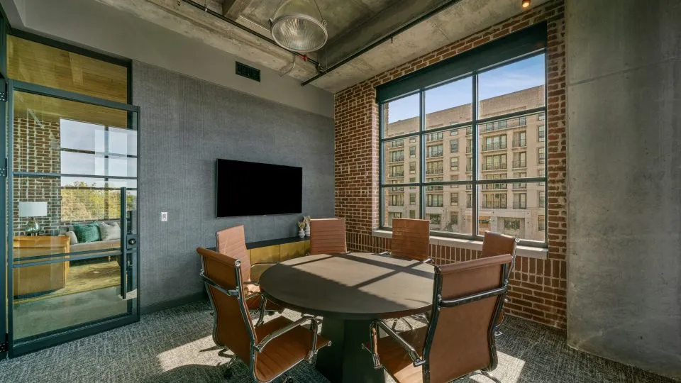 Salt Lake Crossing conference room with round table and large window.