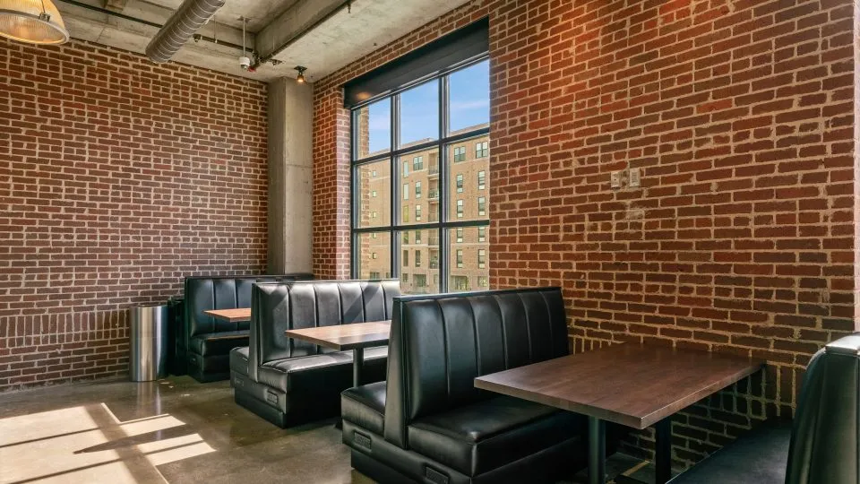 Salt Lake Crossing coffee bar with brick walls and comfortable booths.