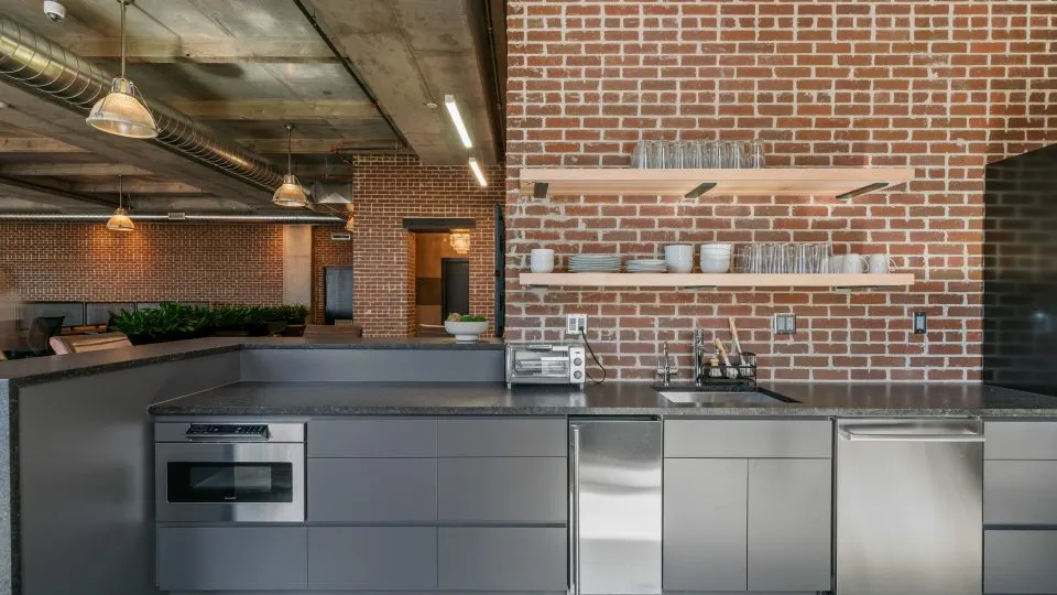 Salt Lake Crossing coffee bar with toaster oven and dishes.