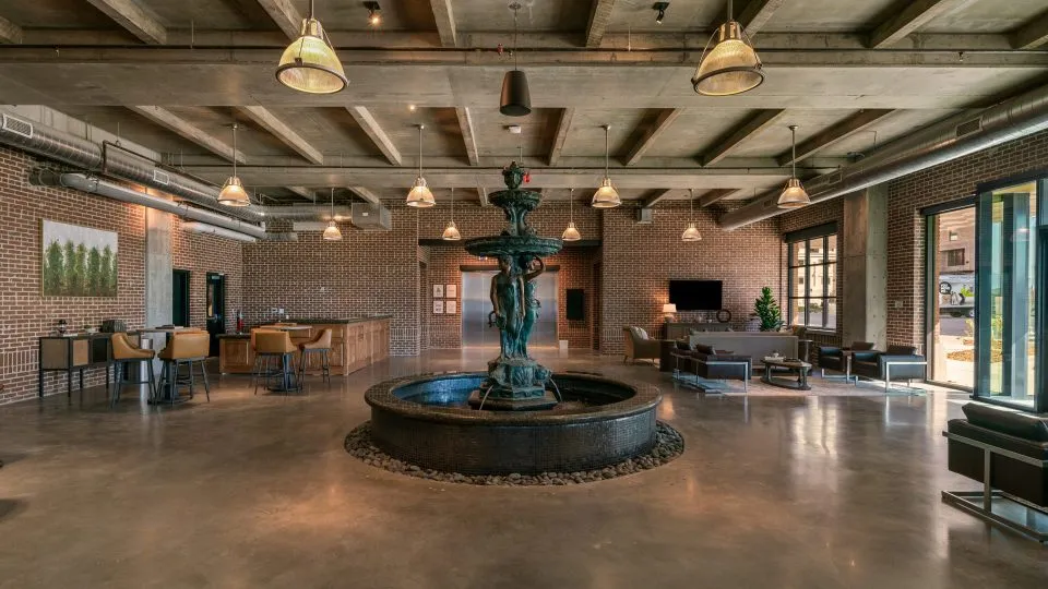 Salt Lake Crossing lobby with leasing desks and large fountain.
