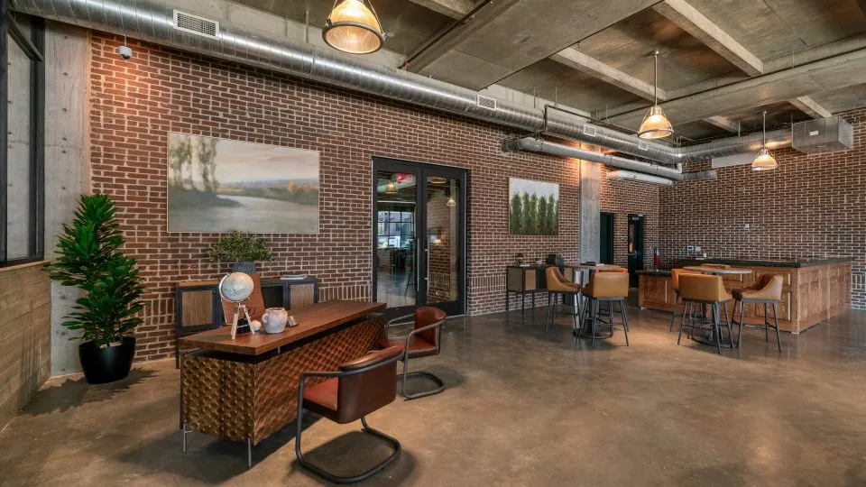 Salt Lake Crossing leasing center with desks and polished concrete floor.