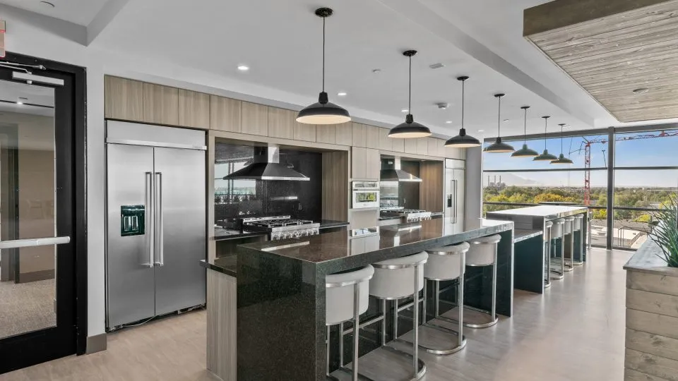 Salt Lake Crossing family room with plush seating and community kitchens.
