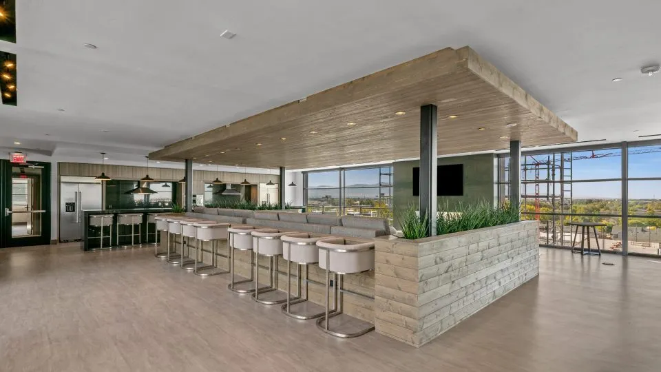 Salt Lake Crossing family room with plush seating and community kitchens.