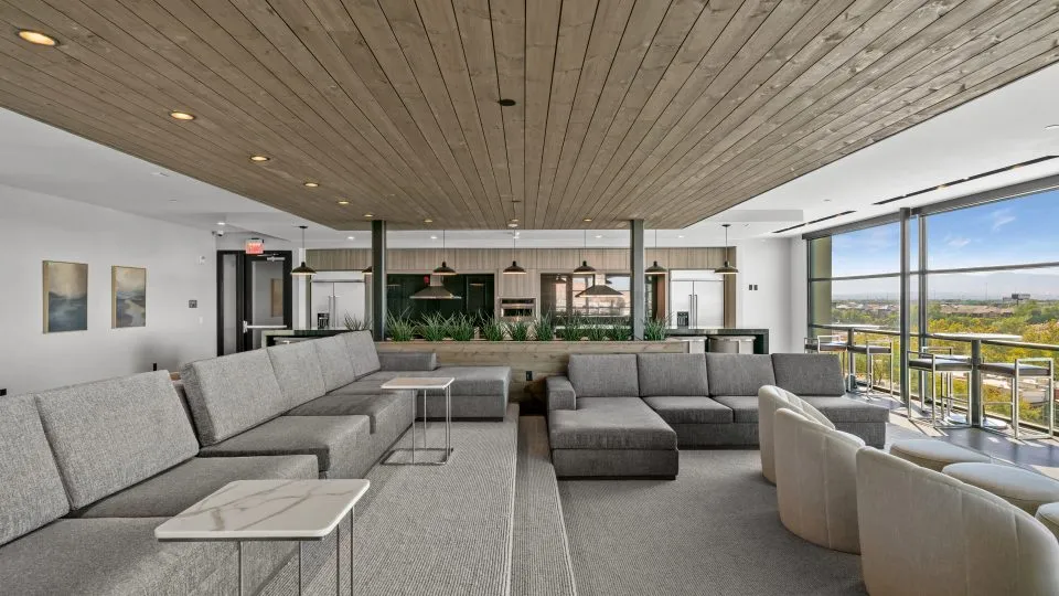 Salt Lake Crossing family room with plush seating and community kitchens.