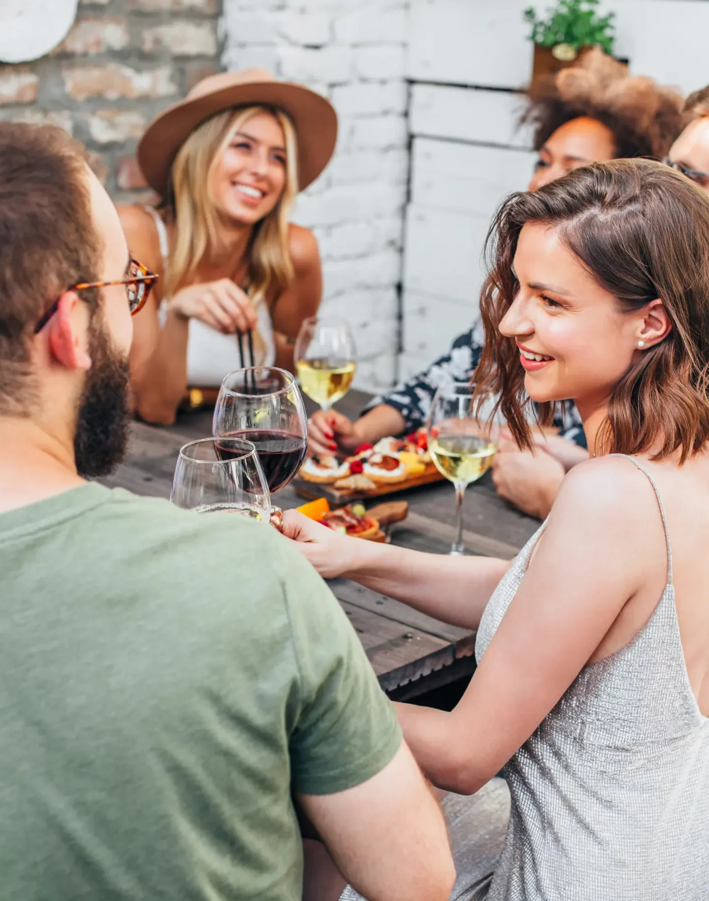 Friends dining together at outdoor restaurant.